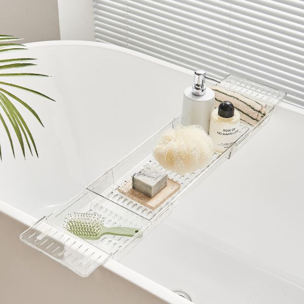 Expandable bath caddy over the bath tray