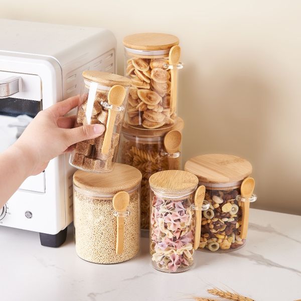 Round Borosilicate glass jar with a bamboo lid and spoon, ideal for kitchen storage