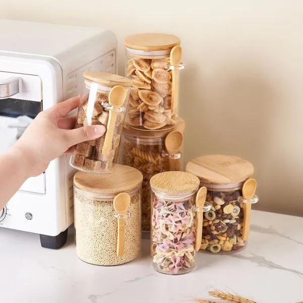 Round Borosilicate glass jar with a bamboo lid and spoon, ideal for kitchen storage